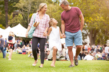 Family Relaxing At Outdoor Summer Event