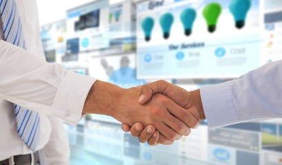 Wall Mural - Composite image of close-up shot of a handshake in office