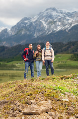 Sticker - group of smiling friends with backpacks hiking