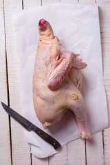 Wall Mural - Raw chicken on wooden table