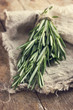 rosemary bunch on a rustic background