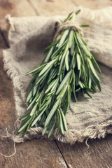 Sticker - rosemary bunch on a rustic background