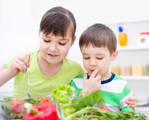 Children eating salad