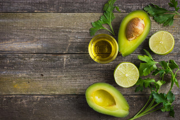 Canvas Print - food background with fresh organic avocado, lime, parsley and ol