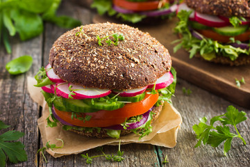 Sticker - Healthy fast food. Vegan rye burger with fresh vegetables