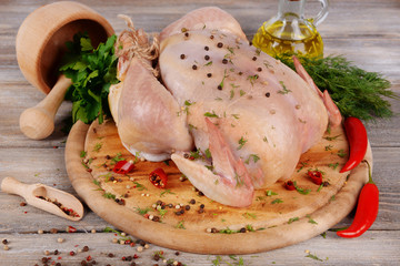 Wall Mural - Raw chicken on wooden table