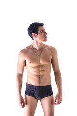 Wall Mural - Handsome, fit young man wearing only underwear standing isolated