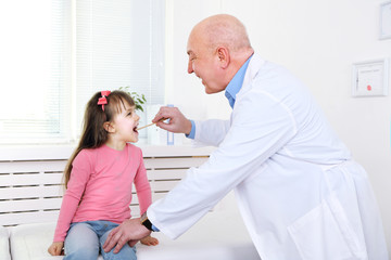 Wall Mural - Little girl and old doctor in hospital