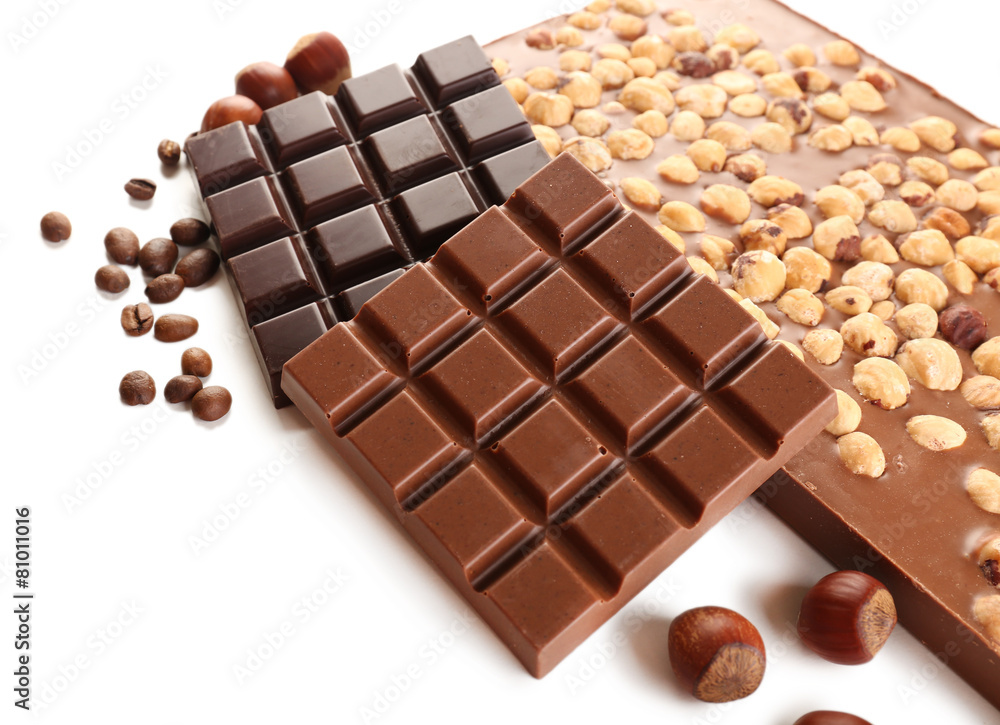 Chocolate bars with hazelnuts and coffee beans isolated on
