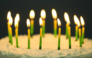 Birthday cake with candles on dark background