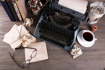 Wall Mural - Retro typewriter on wooden table, top view