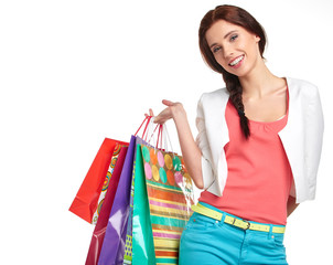 Shopping woman holding bags, isolated on white studio background