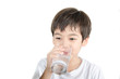 © wckiw - little asian boy drinks water from a glass