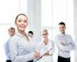 © Syda Productions - young smiling businesswoman with clipboard and pen