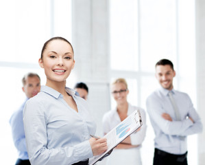 Sticker - young smiling businesswoman with clipboard and pen