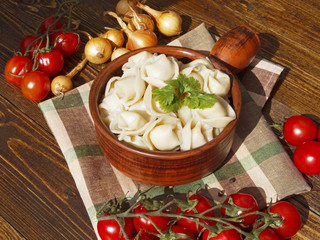 dumplings with meat on a wooden table