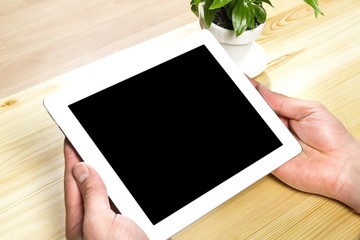 Tablet. Woman hand touch white tablet with blank empty screen