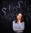 © shefkate - Young girl with question mark on a gray background
