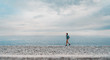 © Alex Photo - Woman walking on beach
