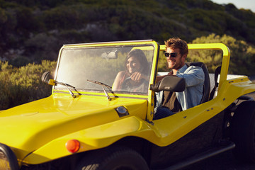 Wall Mural - Handsome young man with his girlfriend on a road trip