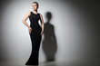beautiful woman model posing in elegant black dress