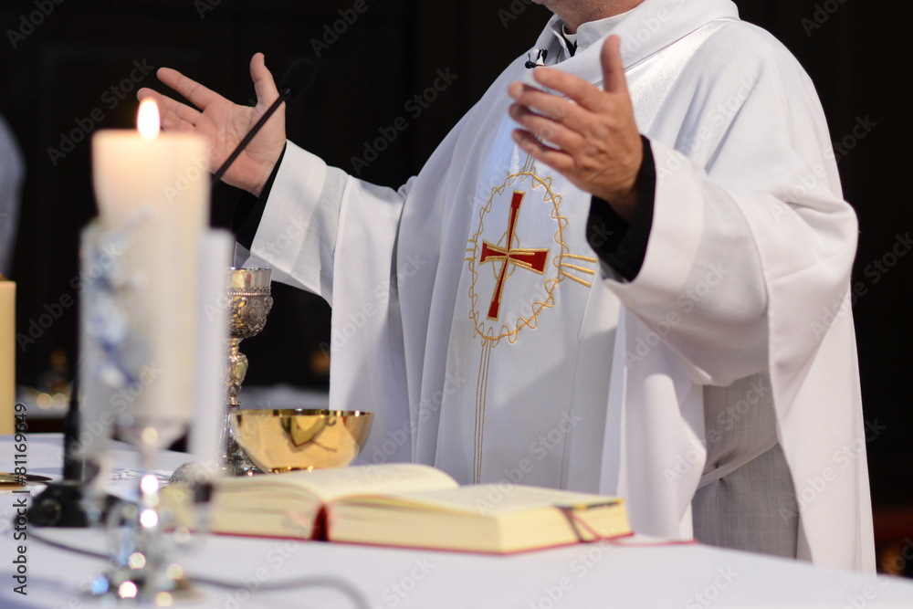 priest and worship at the altar - obrazy, fototapety, plakaty 