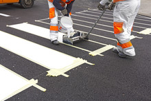 Two Workers Making Of A New Pedestrian Crossing On The Road