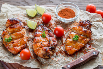 Wall Mural - Grilled chicken breasts in hot mango sauce