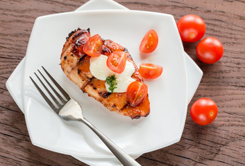 Canvas Print - Grilled chicken steak with mozzarella and cherry tomatoes