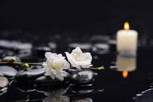 Set Of Cherry Blossom With White Candle On Black Stones
