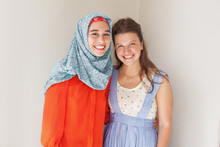 Friendship Of The Religions Concept: Muslim And Christian Girl T
