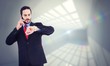 © WavebreakMediaMicro - businessman checking the time while on the phone