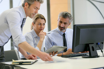 Business team working on project in office