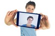 © WavebreakmediaMicro - Casual brunette taking a selfie