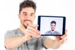 © WavebreakMediaMicro - Casual man taking a selfie