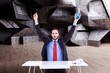 © WavebreakMediaMicro - businessman holding up reading glasses and calculator