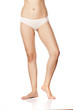 © vladimirfloyd - beautiful female barefoot legs on white. bodycare concept