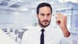 © WavebreakMediaMicro - Composite image of focused businessman writing with marker