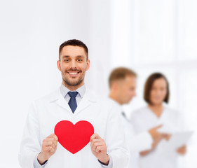 Poster - smiling male doctor with red heart