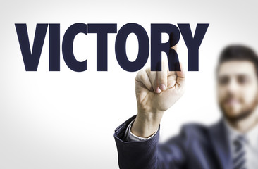 Wall Mural - business man pointing the text: victory