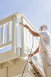 © Andy Dean - House Painter Spray Painting A Deck of A Home
