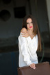 © Domforstock - Lady with white dress in old factory dark room