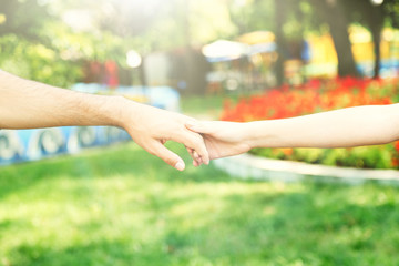 Poster - Loving couple holding hands outdoors