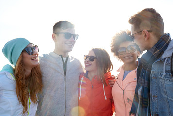 Sticker - happy teenage friends in shades talking on street