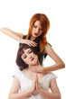 © Wisky - Sexy red-haired woman doing neck massage to girl
