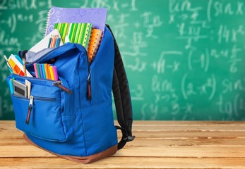 Poster - School. Backpack with school supplies including, notebooks, pens