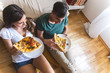 © BalanceFormCreative - Young couple eating pizza