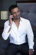 © wernerimages - businessman on the phone sitting in bedroom