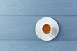 © GCapture - cup of fresh espresso on vintage blue table from above