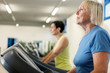 © Francesco83 - Two mature women are running on a treadmill